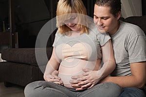Pregnant couple at home