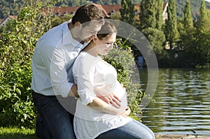 Pregnant couple hugging