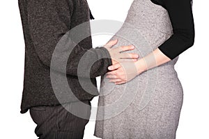 Pregnant couple in woolen dresses