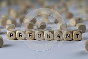 Pregnant - cube with letters, sign with wooden cubes