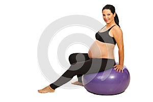 Pregnant doing fitness exercises