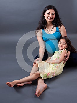 Pregnant East Indian Woman with her Daughter