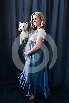 Pregnant european woman with her dog in white apartment, european woman waiting for a child, prenant woman with light