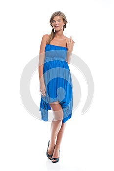 Pregnant fashion model in a blue dress for pregnancy. Clothes for pregnant women