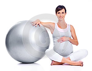 Pregnant female person, ball and studio for pilates, wellness and exercise for motherhood. Maternal woman, workout and