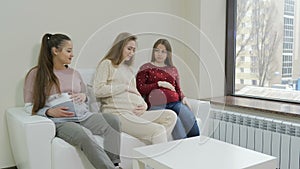 Pregnant girl feeling bad while waiting doctor in the waiting room