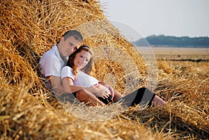 The pregnant girl and the guy on a mow