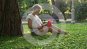 Pregnant girl in the park outdoors