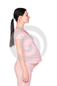 Pregnant girl posing sideview photo