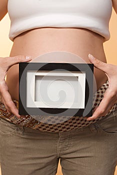 Pregnant girl studio shot