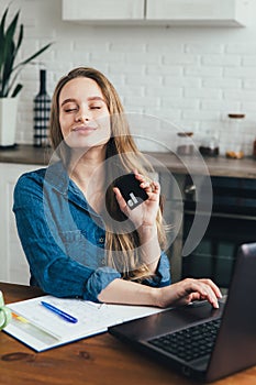 Pregnant girl works at home in self-isolation mode in quarantine and makes online purchases