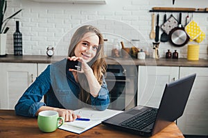 Pregnant girl works at home in self-isolation mode in quarantine and makes online purchases