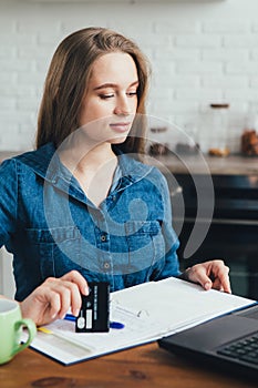 Pregnant girl works at home in self-isolation mode in quarantine and makes online purchases