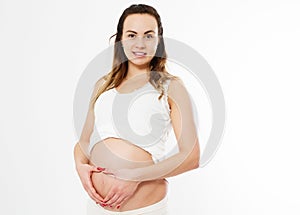 Pregnant happy Woman touching her belly. Pregnant middle aged mother portrait, caressing her belly and smiling close-up on white