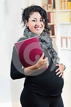 Pregnant hispanic woman wearing casual clothes at