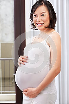 Pregnant lady caress her stomach