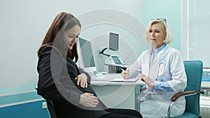 Pregnant lady comes to appointment with ultrasound doctor