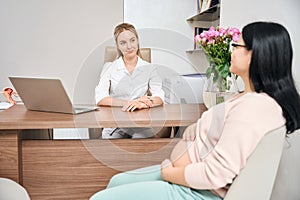 Pregnant lady sitting at gynecologist office