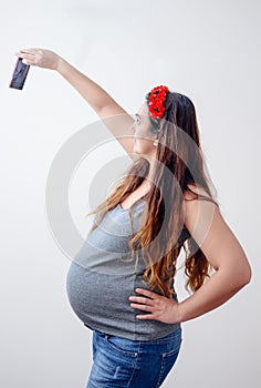 Pregnant lady taking a self portrait