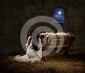 Pregnant Mary Leaning on Manger photo