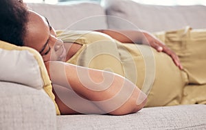 Pregnant, maternity and sleeping woman resting holding her tummy or stomach and relax expecting a baby. Home, pregnancy