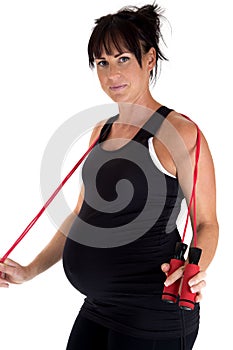 Pregnant model working out with a jump rope