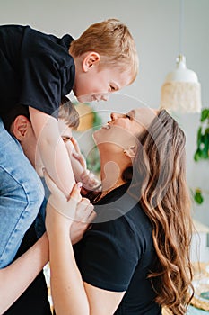 pregnant mom, dad rides son on shoulders. games and relationships with children