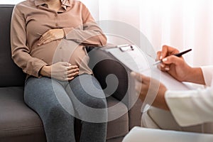 The pregnant mother is discussing depression symptoms during pregnancy with a specialist doctor or psychiatrist