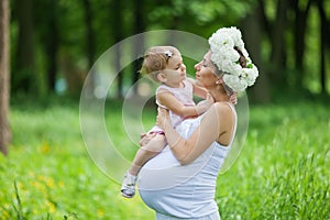 Pregnant mother and her daughter