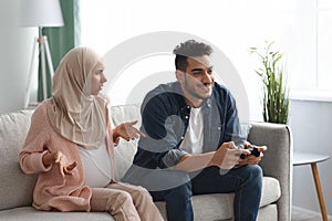 Pregnant muslim lady offended to her careless husband playing video games