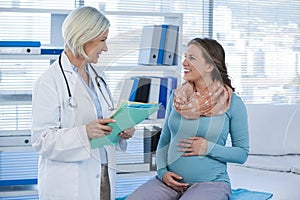 Pregnant patient consulting a doctor