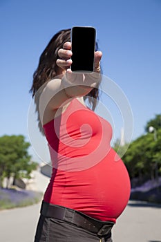 Pregnant showing mobile screen