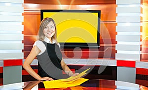 Pregnant television anchorwoman at TV studio photo