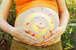 Pregnant woman abdomen with drawing