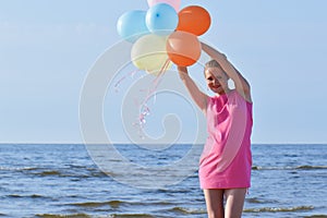 Pregnant woman with air balloons