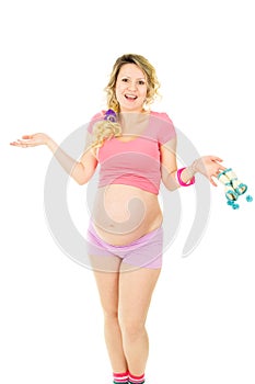 Pregnant woman with baby shoes isolated