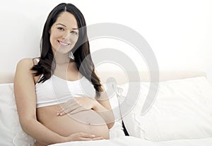 Pregnant woman in bed