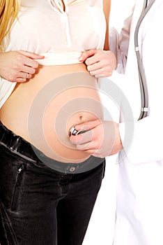 Pregnant woman being examine by doctor