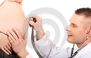 Pregnant woman being examine by doctor