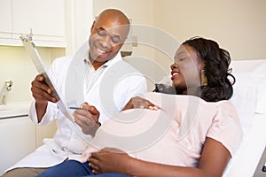 Pregnant Woman Being Given Ante Natal Check By Doctor