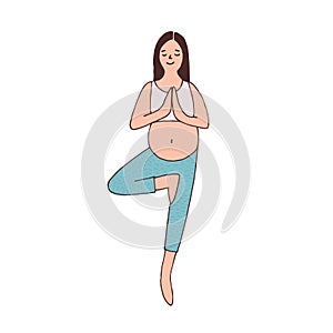 Pregnant woman with belly practicing pregnancy yoga and standing in tree pose. Peaceful young female balancing in