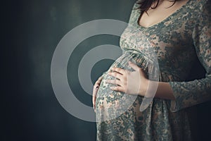 Pregnant woman belly . Pregnant woman holding hands around her belly . Pregnancy concept