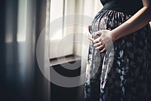 Pregnant woman belly . Pregnant woman holding hands around her belly . Pregnancy concept