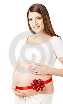 Pregnant woman belly with red ribbon gift. Child birth present