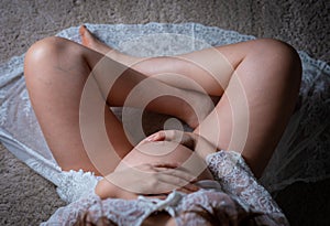 Pregnant woman belly in yoga position shot from above