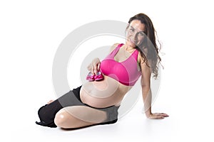 Pregnant woman belly over white background