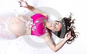 Pregnant woman belly over white background