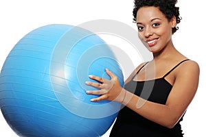 Pregnant woman with big blue gymnastic ball