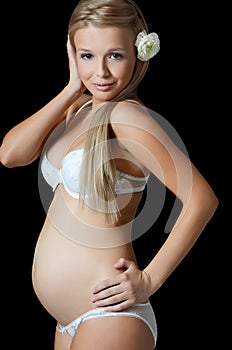 The pregnant woman On a black