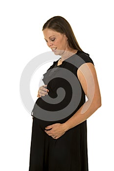 Pregnant woman in black dress stand look down